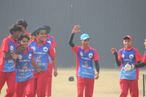 Cricket player showing excitement after getting the batsman out