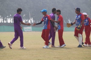 Cricket players meeting and celebrating together after winning the match