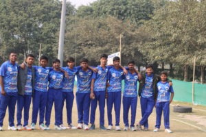 Cricket team huddled together, discussing strategy and teamwork