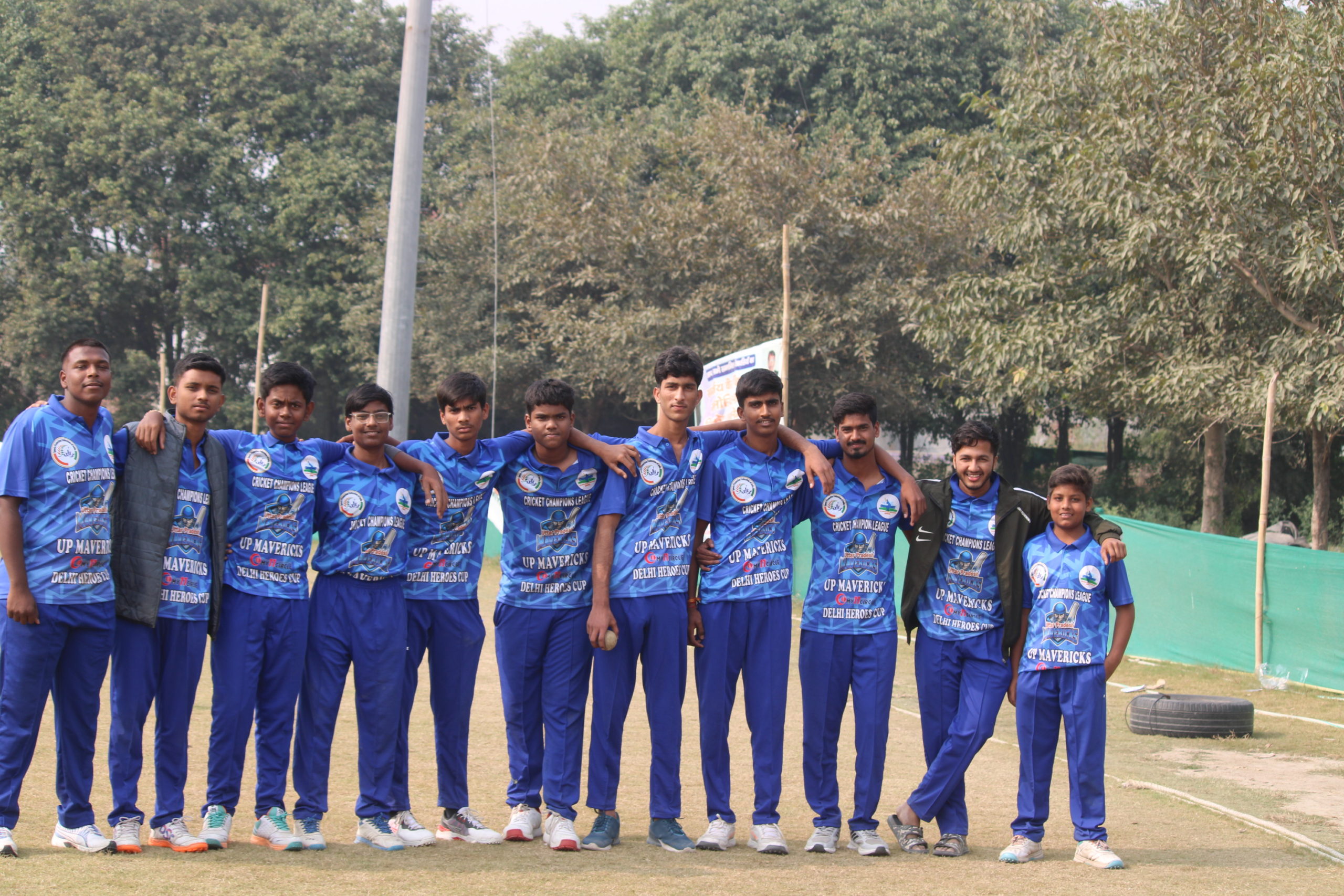 Cricket team huddled together, discussing strategy and teamwork