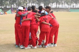 Group of cricket players engaged in discussion
