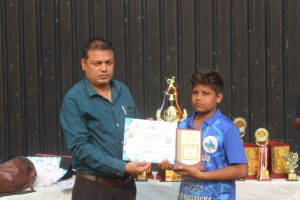 Cricket player receiving award after match for outstanding performance