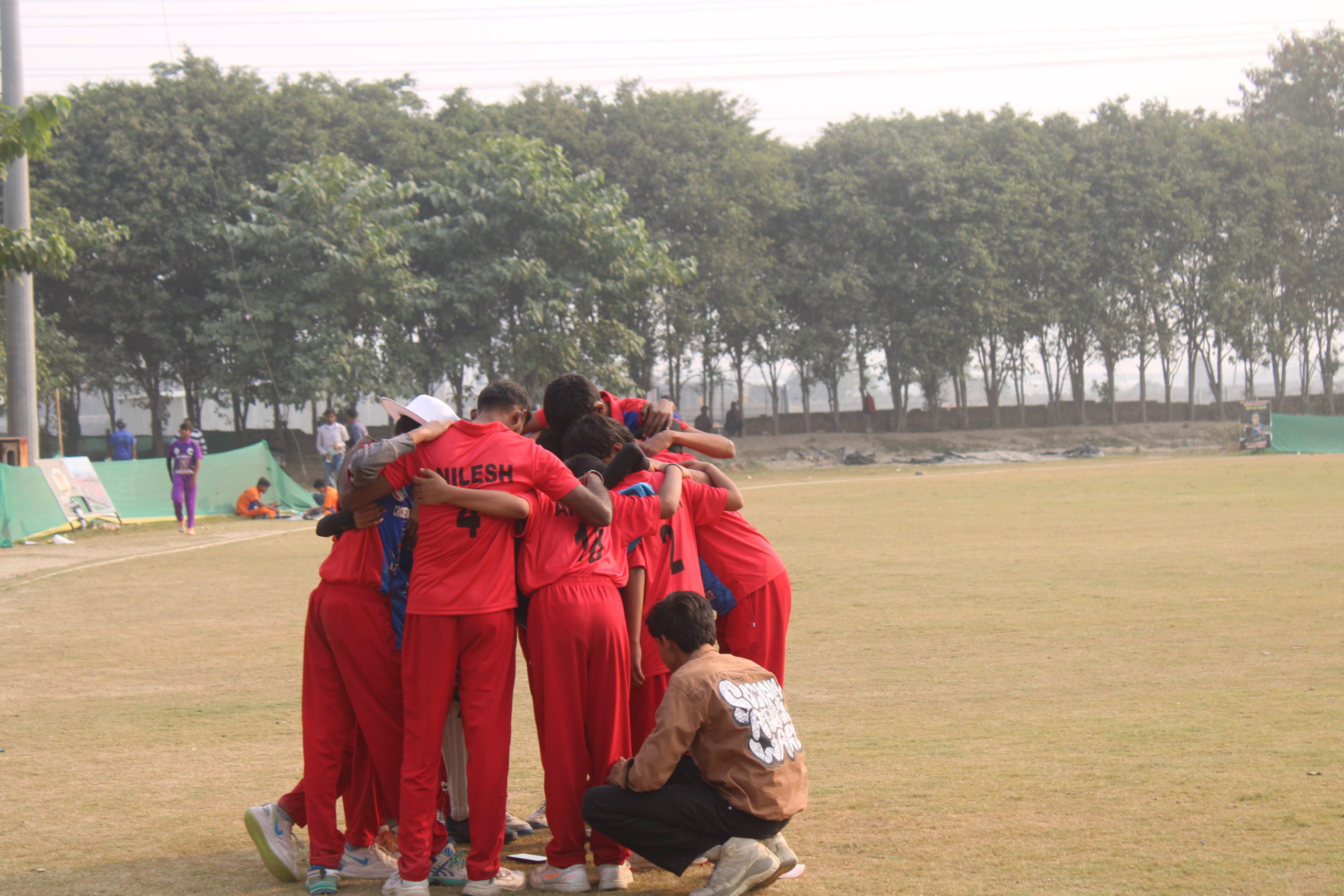 Young players participating in cricket trials in UK cities, showcasing skill and match performance.